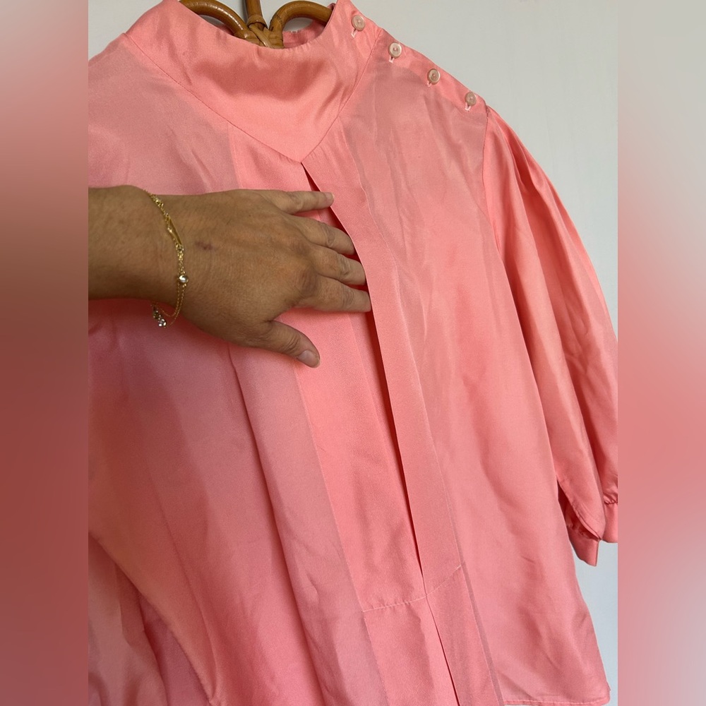 80’s Vintage Coral Pink Blouse. 
Pairs best with fluffy bangs